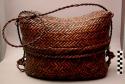 Dark rattan basket with cover