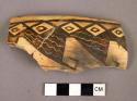 Restorable jeddito black on yellow potsherd