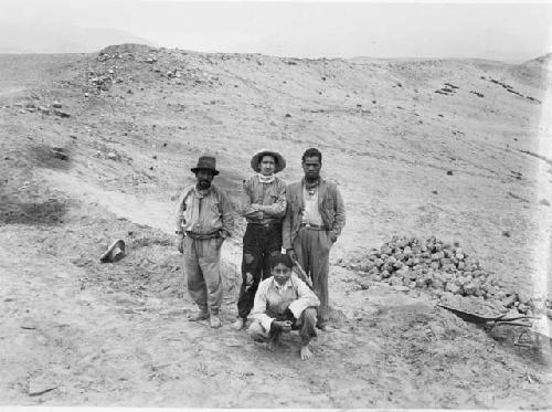 4 men at excavation of Pachacamac