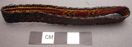 Basketry arm band - dark brown with red & yellow design