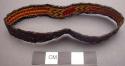 Basketry arm band - dark brown with red & yellow design