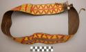 Wide basketry belt with slit at sides--brown with red and yellow design
