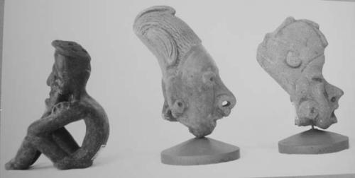 Seated figurine and 2 figurine heads