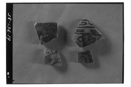 Four polychrome sherds from test pit 5-38, 2-3 meter level.