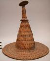Coiled basketry hat, horizontal stripes, alternating dark and natural