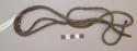 Organic, fiber, sling fragment, braided dark brown fiber cords, central section