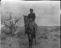 Navajo Man on Horseback