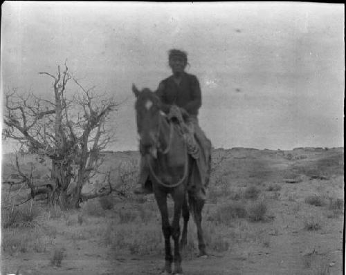 Navajo Man on Horseback