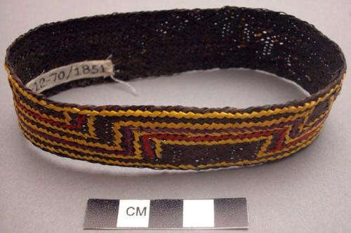 Basketry arm band - brown with red, purple and yellow design