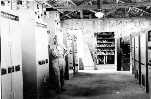 Man posing in control room