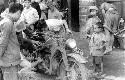 Men inspecting motorcycle