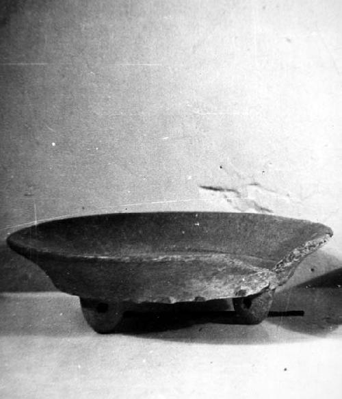 Merida Museum. Pottery vessel.  Polished red tripod dish.  Hollow lemon-shaped f