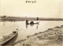 Life scene in the river with men and boats