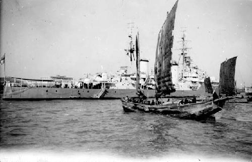 Boats in front of ship
