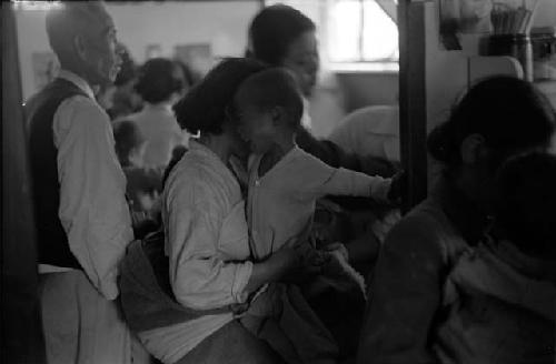 Man standing with crowd inside