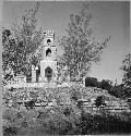 Str. 14, substructural ter. walls, and modern hacienda church on top.