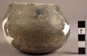 Small restored plain grey ware pottery vessel