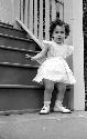 Young girl posed on steps