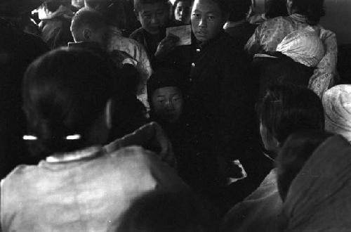 Man holding paper in crowd