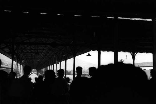 Crowd of people on train platform.