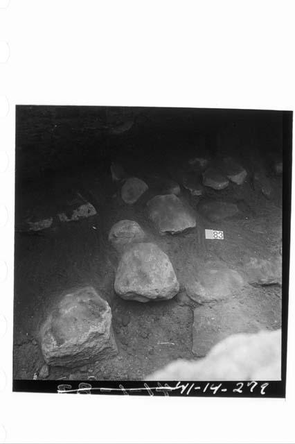 Upper layer of boulders lying W of center-north line of mound in Ph. IIIb adobes