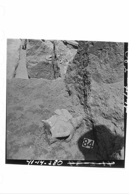 Broken pot in sect. N58.3W, 2.5' below surface at stake N58.2W.  From 3' of sect