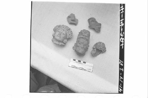 Collection of Fragmentary Heads of Pottery Figurines and Whistles