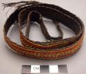Basketry belt - brown with red and yellow designs