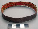 Narrow basketry armband - dark brown with red and yellow design