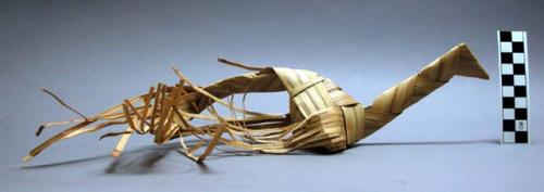 Palm leaf bird, natural color. One of series (39-17-70/1402-1419) strung +