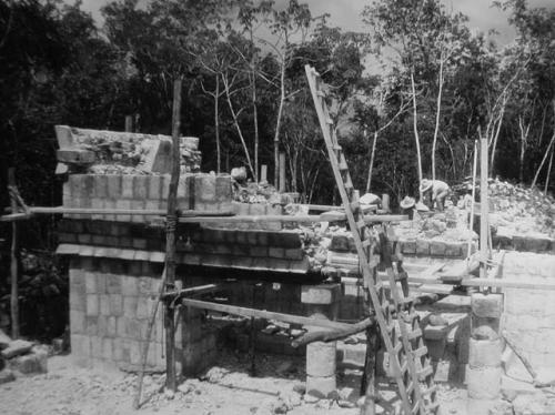 Structure 3E3 - Sweat House, Masons replacing facade of structure above beam