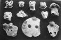 Animal heads and frags. animal-headed, perforated discs (11).