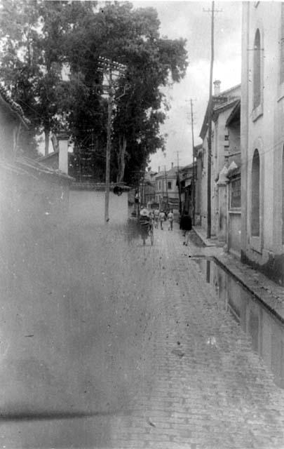 People on a building-lined street