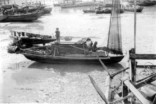 Child on boat; titled "Home on the Range"