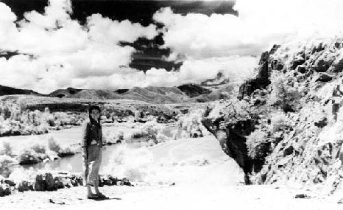 Woman in front of landscape; titled "Our laundry girl"