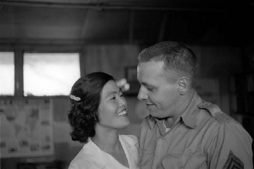 U.S. Soldier and Korean woman looking at each other