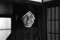 Nun in black habit smiling.