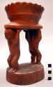 Wooden figure - 2 figures holding bowl over heads