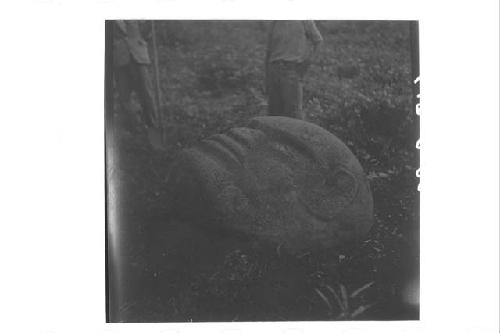 Carved monolithic stone head