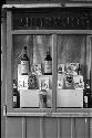 liquor bottles through store window