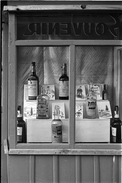 liquor bottles through store window