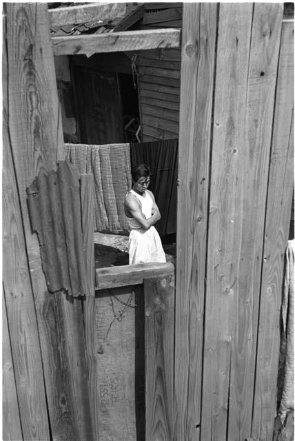 Woman standing in front of a clothsline