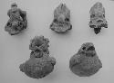 Miniature pot-whistles and heads from others