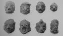 Figurine heads (8), all read slipped save perhaps #8, weathered.