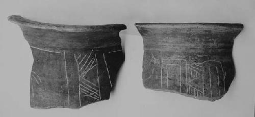 Sherds of tall red vases