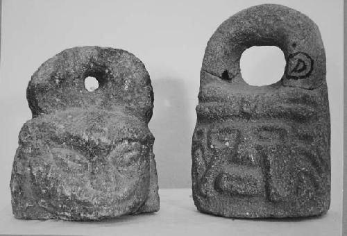 2 handled stone objects - mauls?