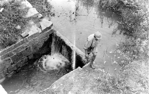 Man standing by river