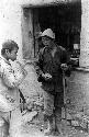 Man and boy smoking cigarettes