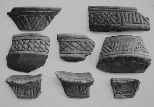 Brown-black coarse incised sherds (8)