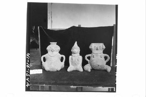 Three Seated Anthropomorphic Female Figurines of Coarse Dark-Brownish Clay